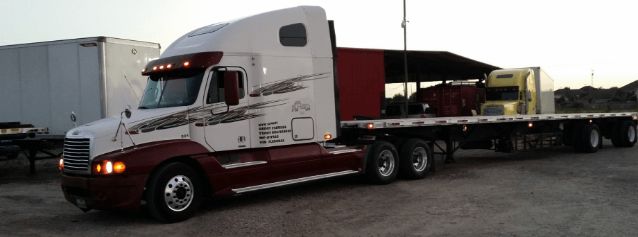 couple with dog infront of truck