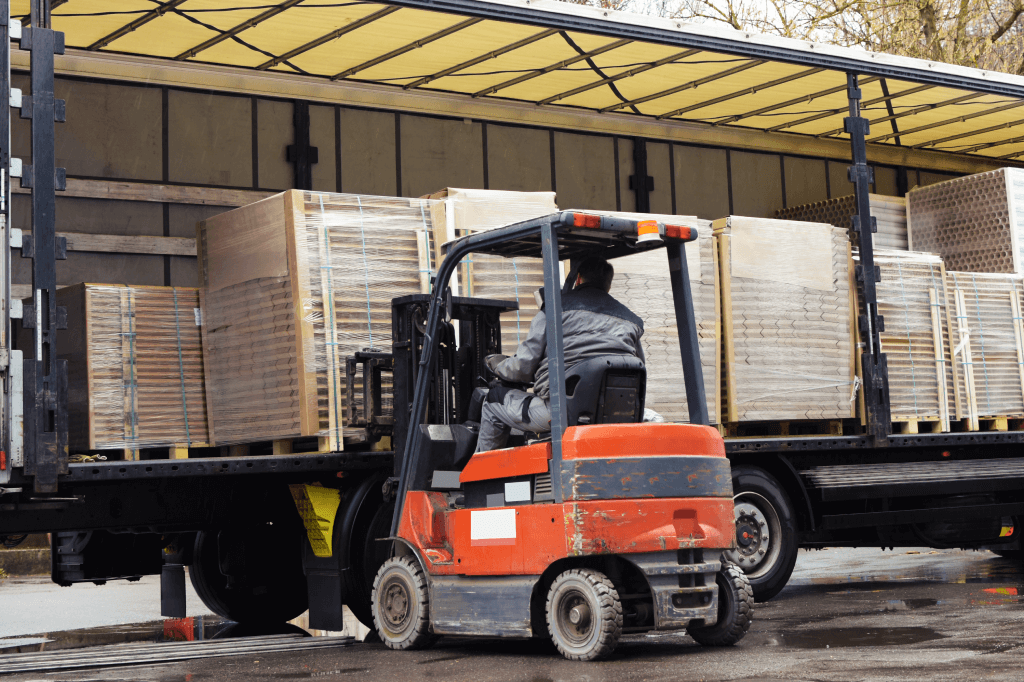 Forklift loading pallets onto a trailer