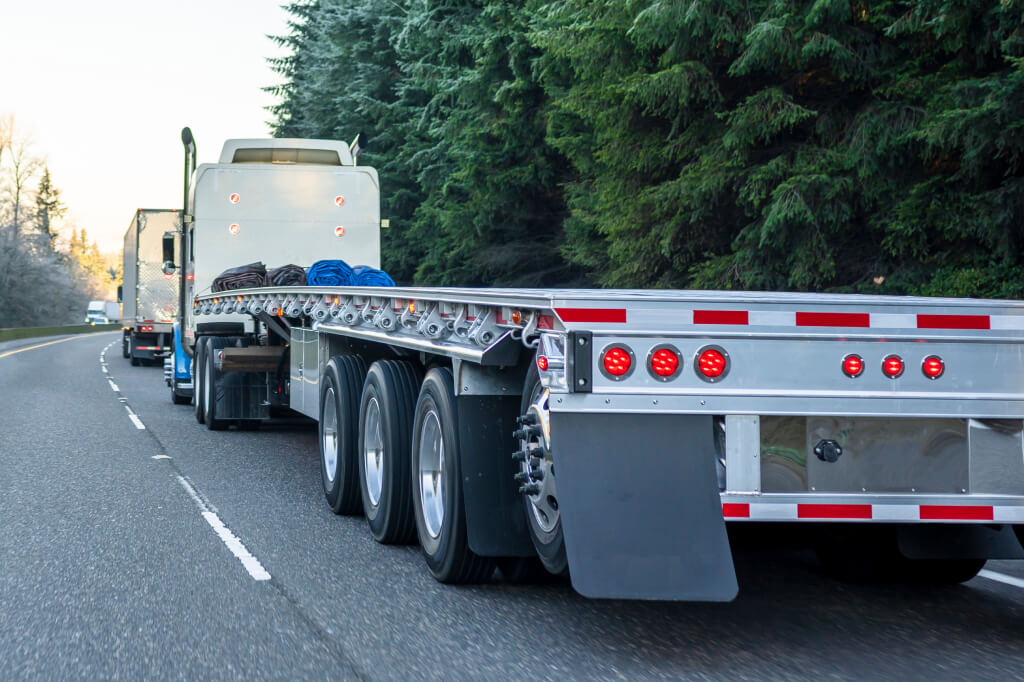 empty flatbed truck driving