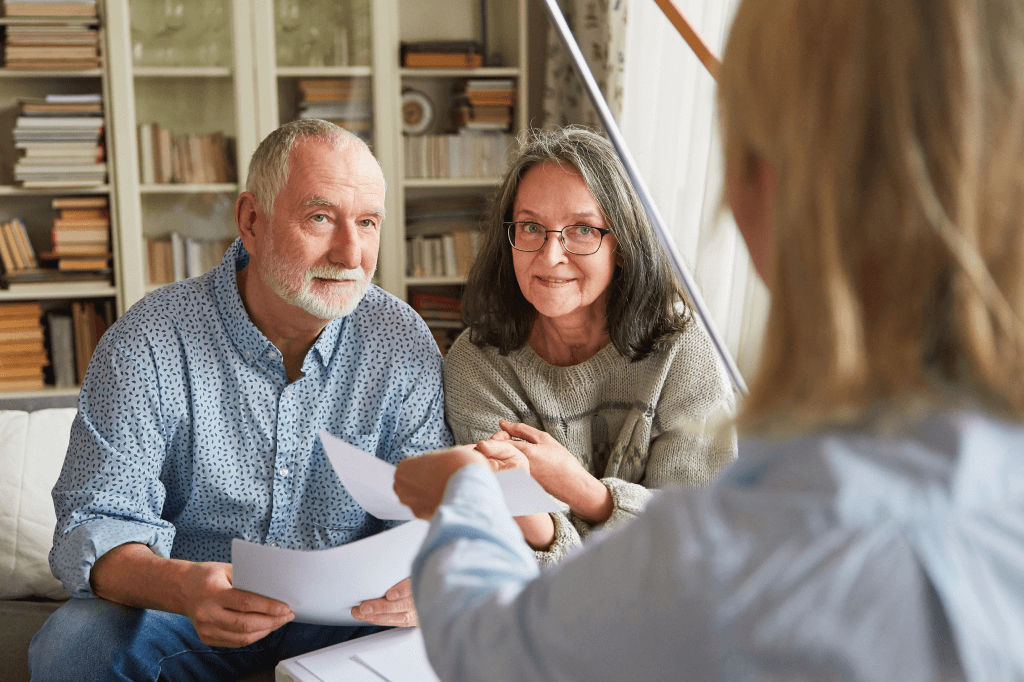 older couple discussing paperwork