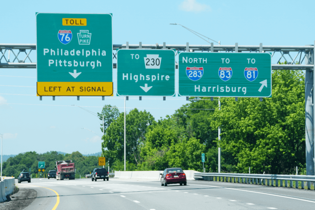 Exit signs on the highway.