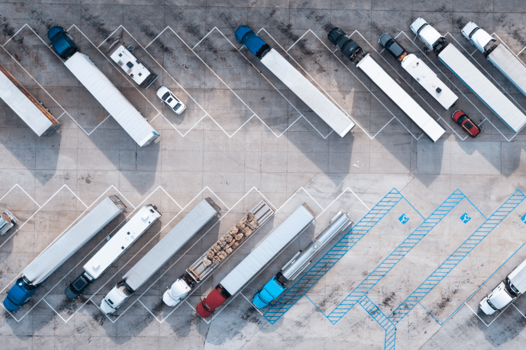 Aerial view of trucks parked in a lot.