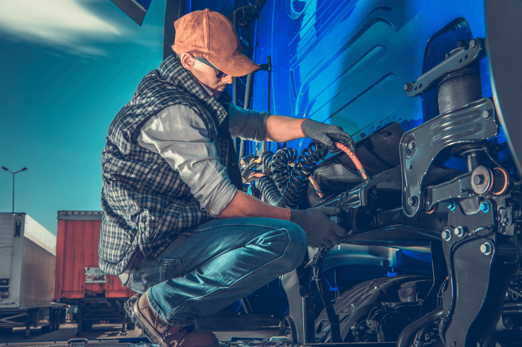 Truckstop.com user performing maintenance on a truck.