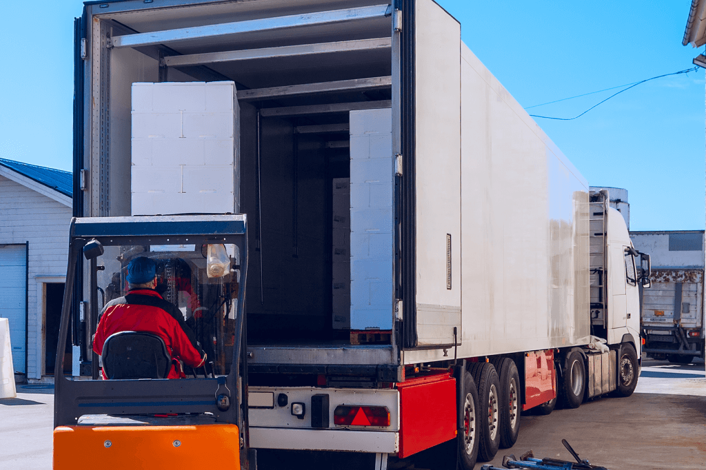 Trailer being loaded with a forklift.