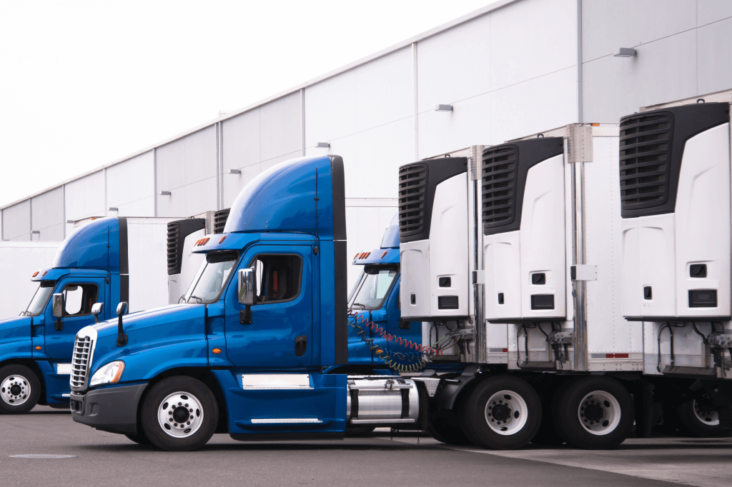 Trucks backed to a dock.