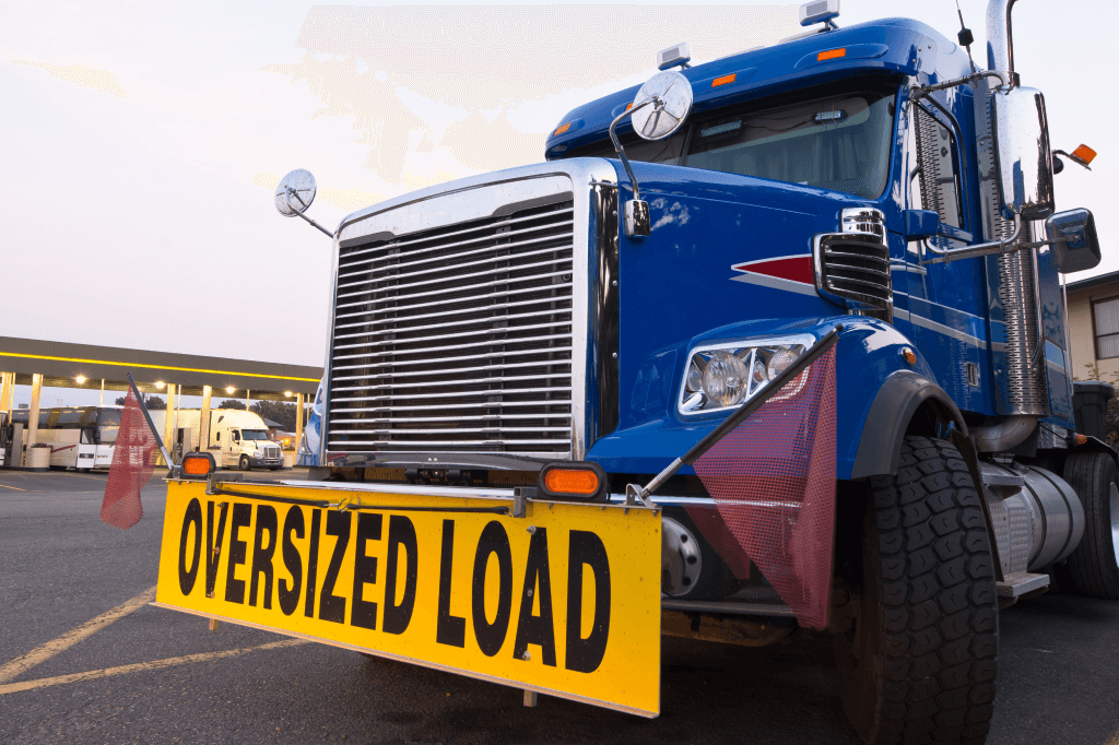 front of semi truck with oversized load sign