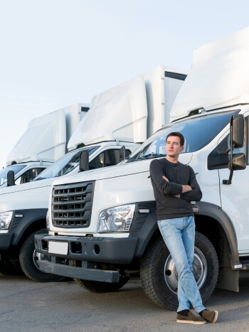 Carrier leans up against a box truck.