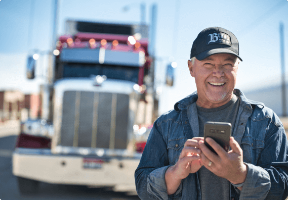 Truckstop customer using asmartphone to find loads.