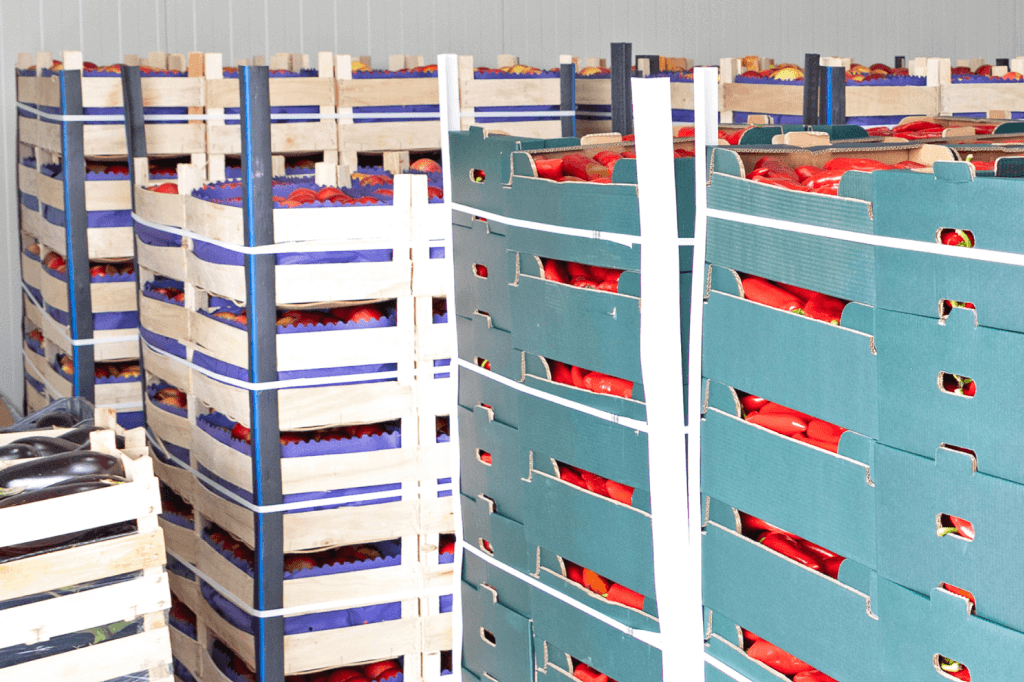 Cases of produce stacked in pallets.