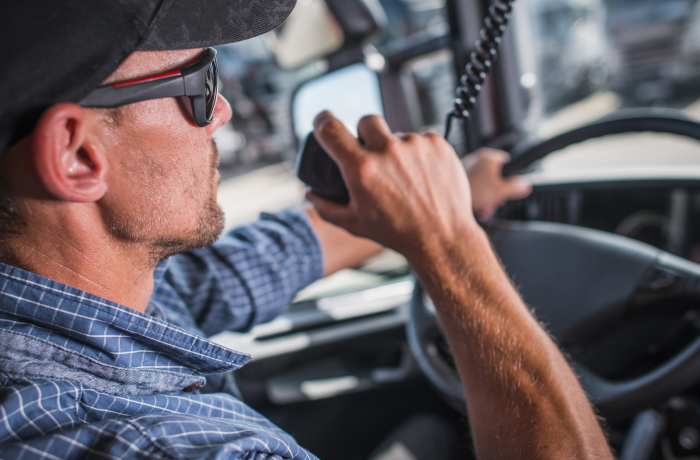 person talking on CB radio mic